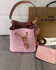 NWT Coach CEA23 Rowan Bucket Bag In Signature Canvas With Charms Powder Pink New