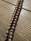 Red, white, and gold beaded necklace with alternating red and white beads #beade — photo 4