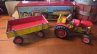 VINTAGE SCHYLLING WIND UP TIN TRACTOR AND TRAILER WITH BOX