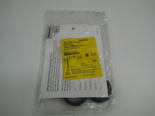 Yellow TURCK M2010093 NSMP package with black rubber O-rings, safety data sheet, and printed product details.