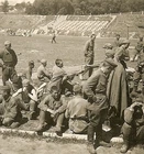 WAR IS OVER! German View of Captured Russian Soldier POW's Held on Sportsfield!