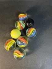 6 Cats Eye 1 Shooter Marbles Plus Two Other Solid Color Marbles