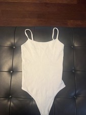 OQQ Women's White Ribbed Spaghetti Strap Thong One Piece Bodysuit S Regular