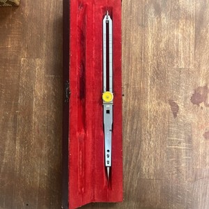 This is a proportional compass (dividing compass) in a case. USCE