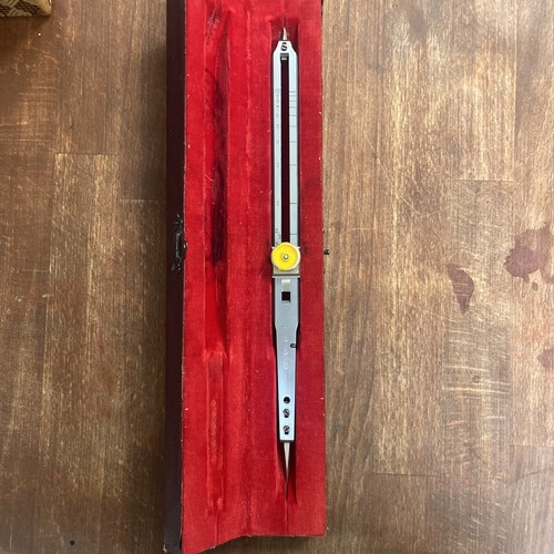 This is a proportional compass (dividing compass) in a case. USCE