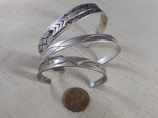 Collection of 3 FRED HARVEY era Navajo silver bracelets