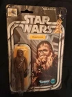 Starwars 1977 Kenner Chewbaca action figure  with 12 A card. Damaged packaging