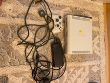 xbox 360 console, controller, and games shown.