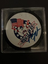 BILL BAKER  1980 OLYMPIC HOCKEY MIRACLE ON ICE AUTOGRAPHED PUCK “GRANDSTAND”