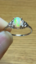 49B- .70ct Genuine Ethiopian Welo Opal Set in a 925 Sterling Silver Size 9 Ring