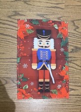 Nutcracker Red CHRISTMAS GARDEN FLAG 11  X 18" Poinsetta background
