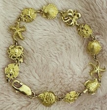 14k Yellow Gold Seashell, Starfish, Octopus, Sand Dollar Theme Bracelet 7.5”