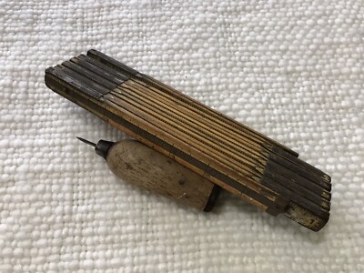 vintage scratch awl carpenters tool and antique folding ruler