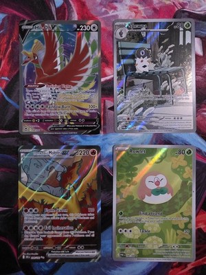 Ho-Oh V 187/195, Team Rockets Moltres ex 208/182, Spewpa 089/088, Rowlet 090/088