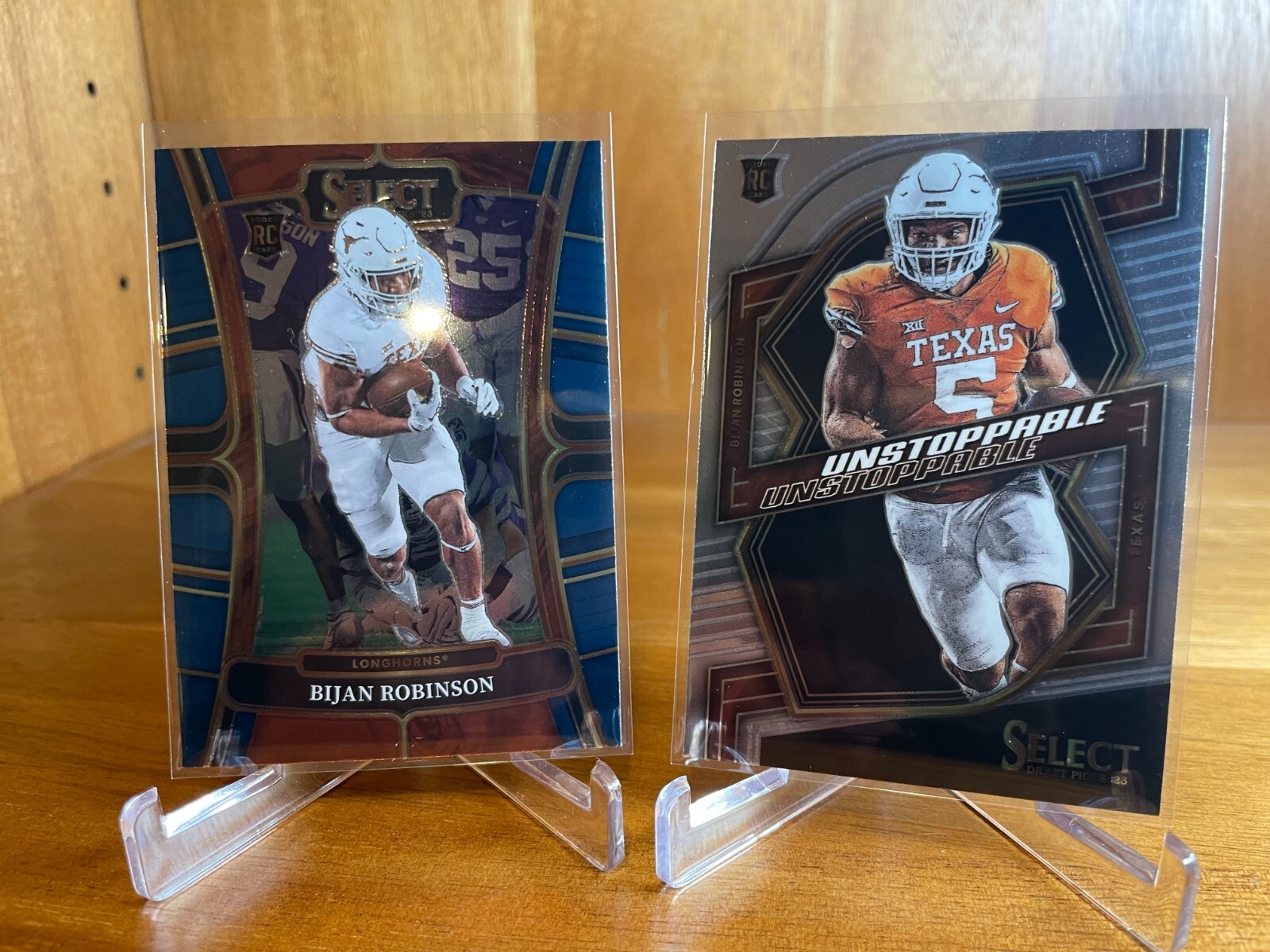 Bijan Robinson 2023 Panini Select Draft Picks Unstoppable RC #UN-5 + BASE TEXAS