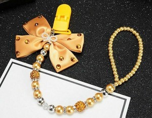 gold pacifier chain