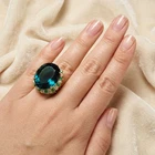 Radiant Lagoon Blue Tourmaline Oval 24.80Ct 925 Sterling Silver 24K Gold Rings