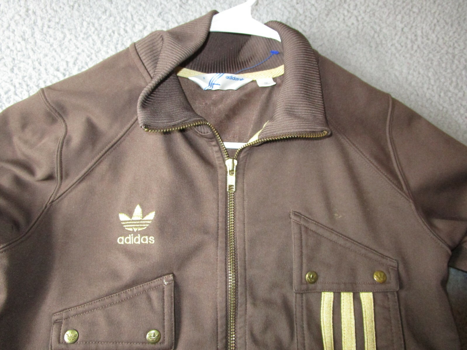 brown and gold adidas jacket