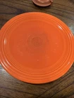 Vintage Homer Laughlin Fiesta luncheon plate in the iconic radioactive red color