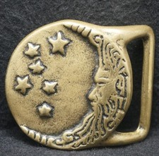 XB23146 VINTAGE 1970s TRINITY MAN IN MOON W/ STARS ARTWORK BRASS BELT BUCKLE