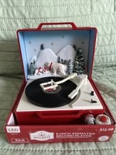 NEW 6 INCH LIGHT UP/MUSICAL RECORD PLAYER.