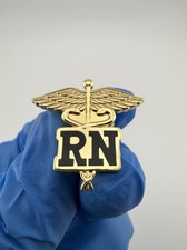 Registered Nurse RN Caduceus Emblem Gold Tone Black Enamel Pin.
