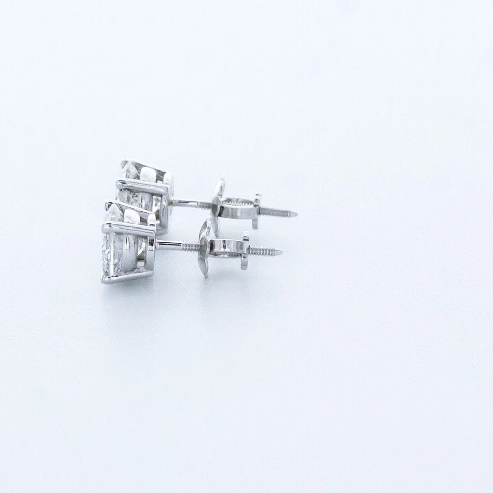 Aretes clásicos de cuatro puntas de oro de 14 quilates de corte redondo H/SI1 de diamantes naturales de 0,5 quilates Foto 4 de 4