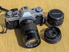 Canon AE-1 35mm SLR Camera Package w/ 50mm Lens, Tele Converter  135mm Lens