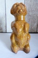 ancienne tirelire a casser chien assis