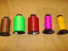 Several partial rolls of X-99 bowstring material