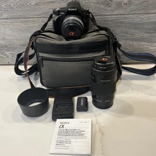 Sony Alpha DSLR-A230 10.2MP Camera with 18-55mm Lens Black and a 75-300mm Lens.