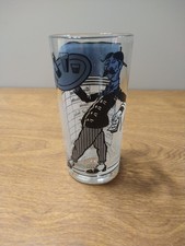 A full set of 8 black-and-blue check-patterned MCM tumblers that look straight out of a Rat Pack cocktail hour — bold graphic pattern makes them genuinely striking.