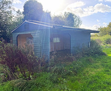 Wooden horse shelter/ Shed on steel skid frame. 10mx3 m approx. Apex lined roof
