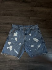 Distressed, bleach-splattered Vintage Wrangler denim cutoff shorts
