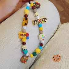 cute pop fun colorful phone charm with candy like beads, cookies and chocolate