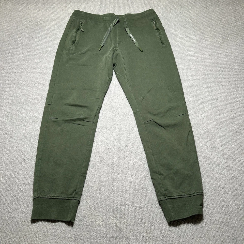 Pantalones deportivos Armani Exchange informales con bolsillos con cremallera para hombre talla pequeña verde Foto 2 de 4