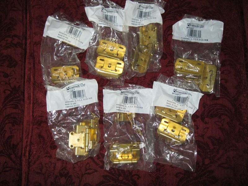 7 sets of new  Amerock  polished brass  1/2" overlay hinges.  Model BP7550-3.
