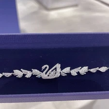 Swarovski vibrant swan button bracelet with elements and crystal swan design.