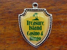 Vintage silver TREASURE ISLAND CASINO BINGO MINNESOTA TRAVEL SHIELD charm 44-33