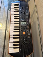 Casio SA-76 Electronic Keyboard, Beautiful orange, black color 100 Tones. Drums