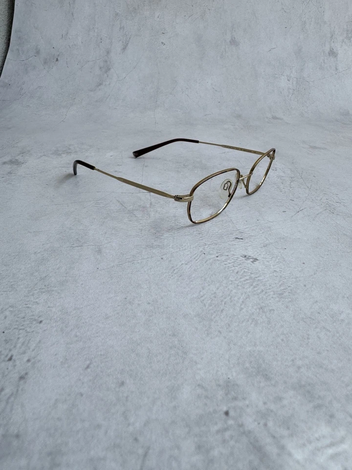 Marco de gafas Flexon ovalado dorado titanio memoria metal ligero Foto 3 de 4