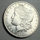 1900 Morgan silver dollar. Satiny white BU $1. #ro1