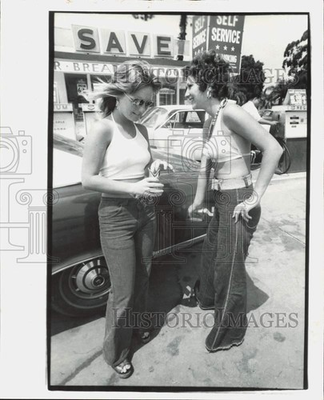 #ad 1975 Press Photo Rose Merrell and Norma Ross load gas at Madeira Beach $24.99
