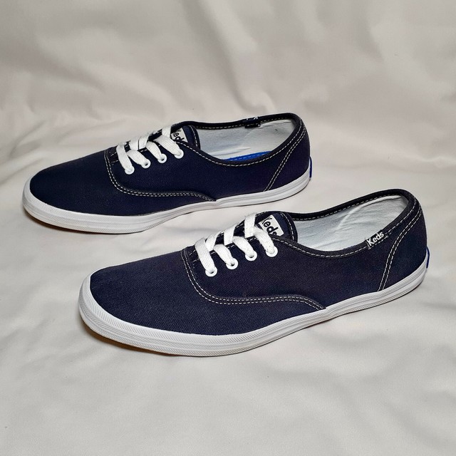 navy blue and white keds