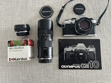 Olympus OM10 35mm Film Camera w/ Lenses, OEM Case and Strap Untested