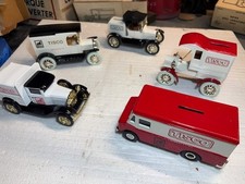 A collection of Five Ertl and Spec Cast 1/25th. Bank trucks from TISCO Company