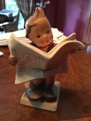hummel boy reading newspaper