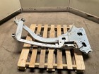 Silver 13-18 RAM 1500 front left driver frame apron radiator support with exposed bolts, resting on a wooden pallet.