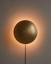 Brass Disc Wall Sconce with Backlight – Modern Ambient Wall Light Fixture
