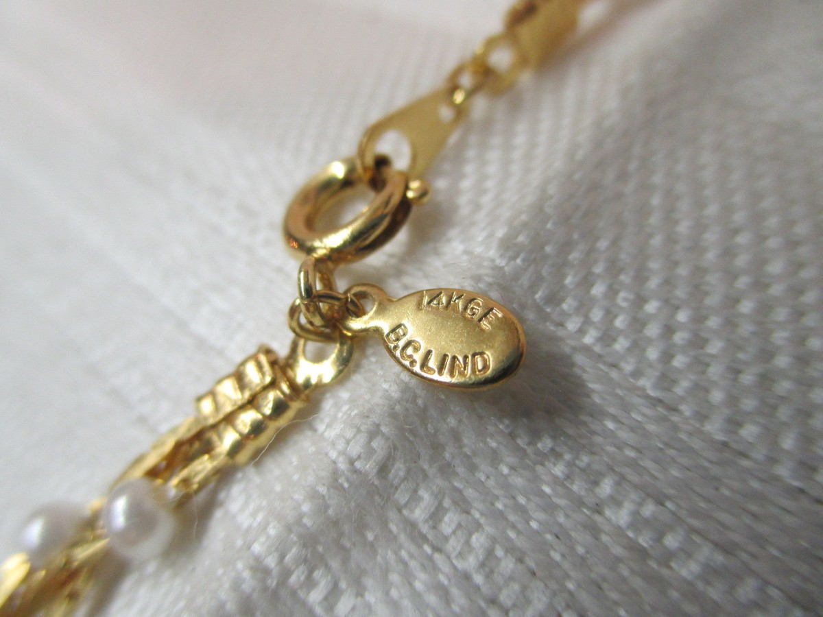 Collier vintage en fausses perles graduées en or - France
